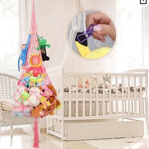 Handmade boho hanging stuffed animal hammock ceiling.